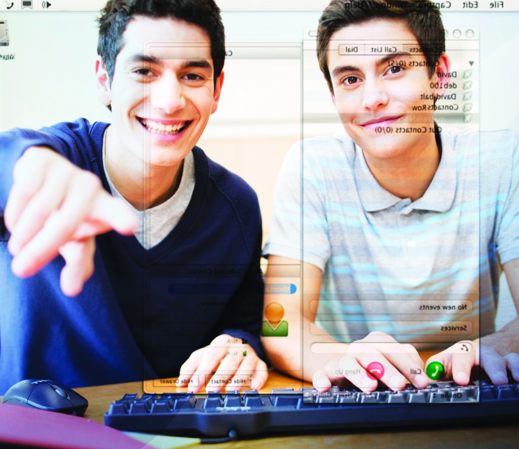 Two teenage boys using a computer