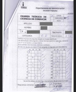 Prueba teórica aprobada con la misma caligrafía en las respuestas y en la validación